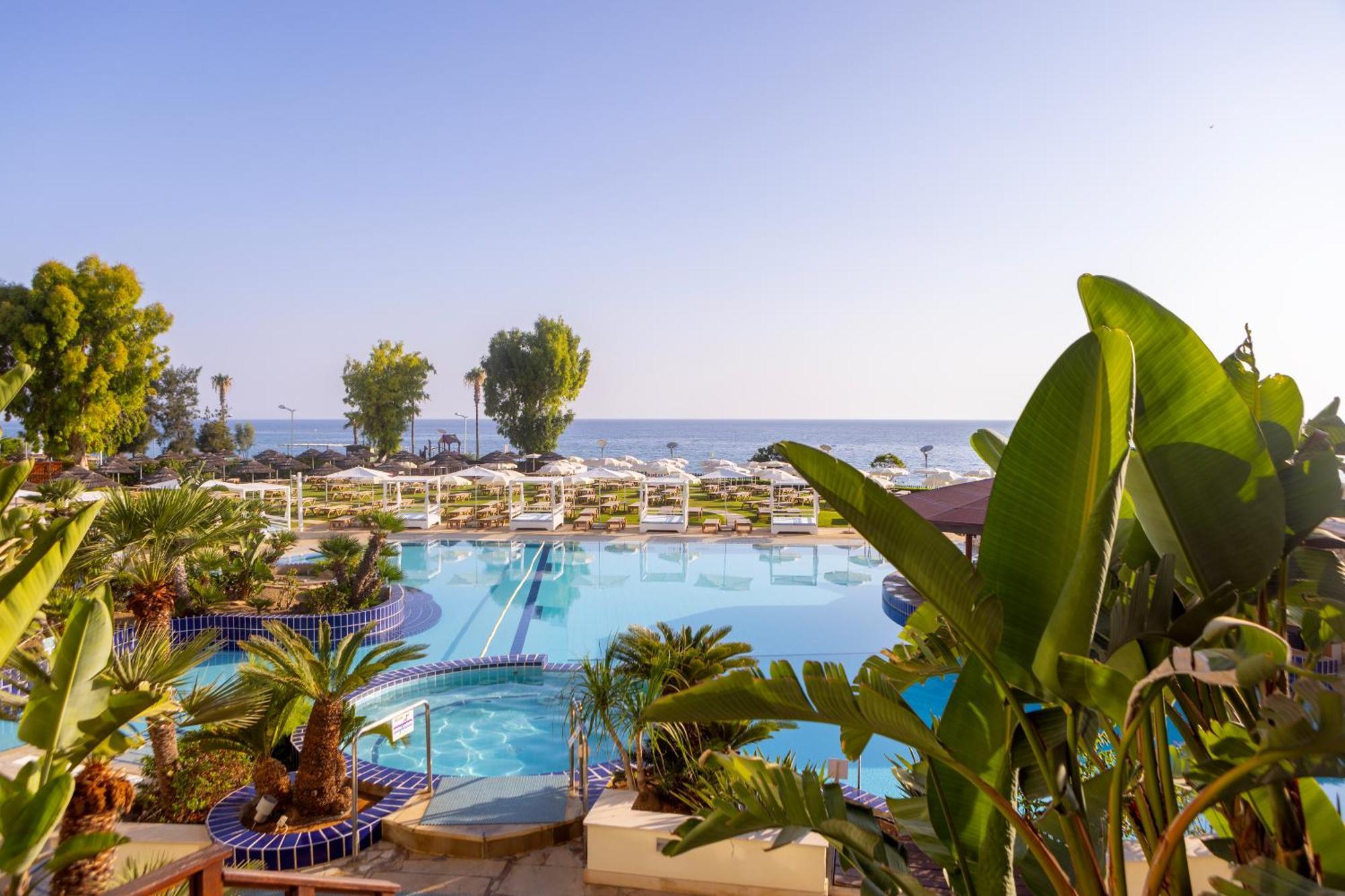 Capo Bay Hotel Protaras Bagian luar foto A swimming pool at a hotel in Cyprus