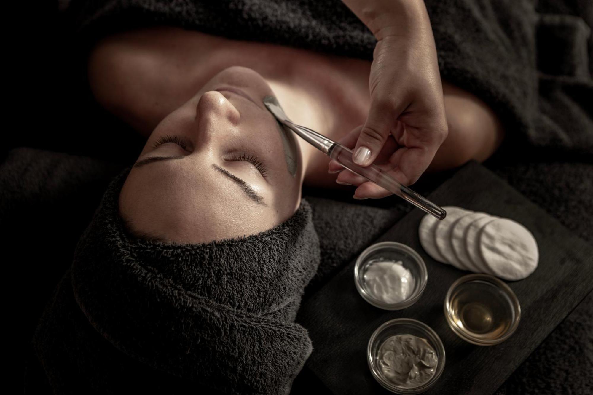 Capo Bay Hotel Protaras Bagian luar foto A woman receiving a facial treatment